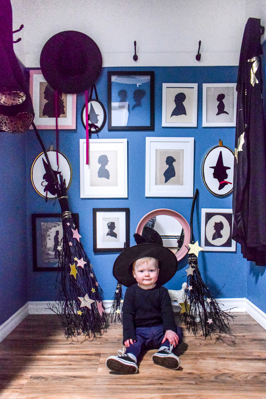 Turn your entryway into a spooky and glam witch broom closet. One that any witch would be pleased to hang her cloak in.