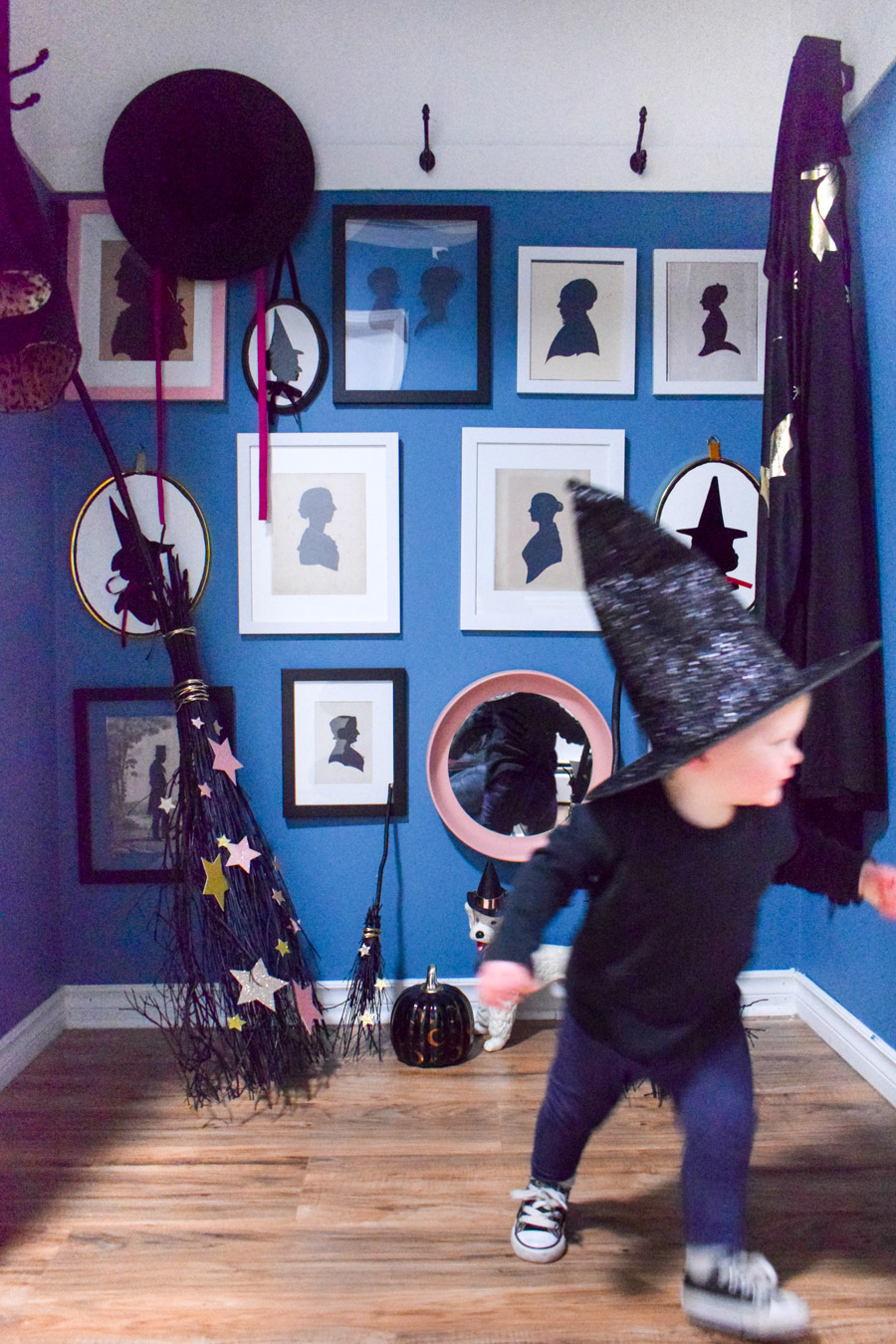 Turn your entryway into a spooky and glam witch broom closet. One that any witch would be pleased to hang her cloak in.