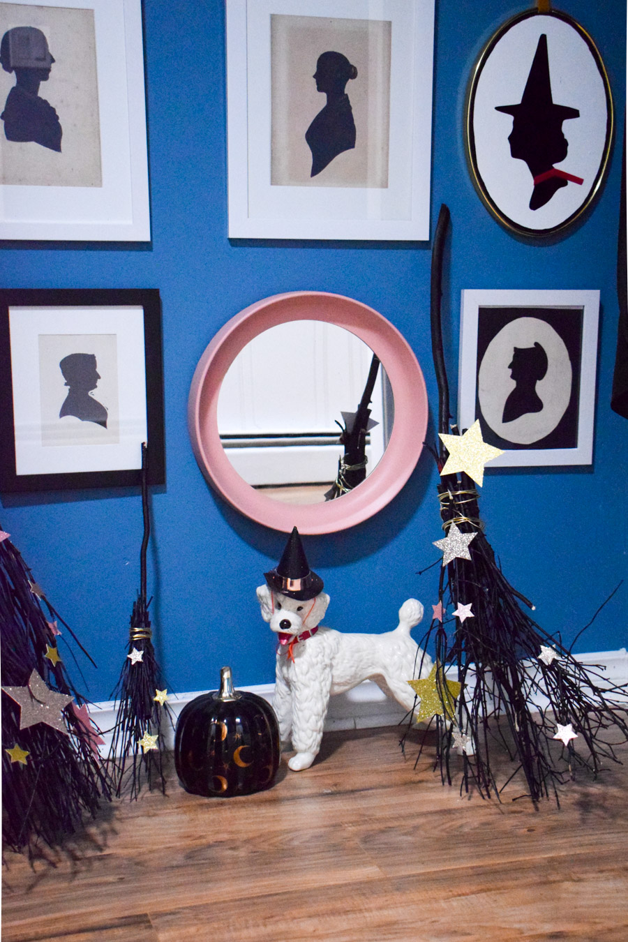 Turn your entryway into a spooky and glam witch broom closet. One that any witch would be pleased to hang her cloak in.