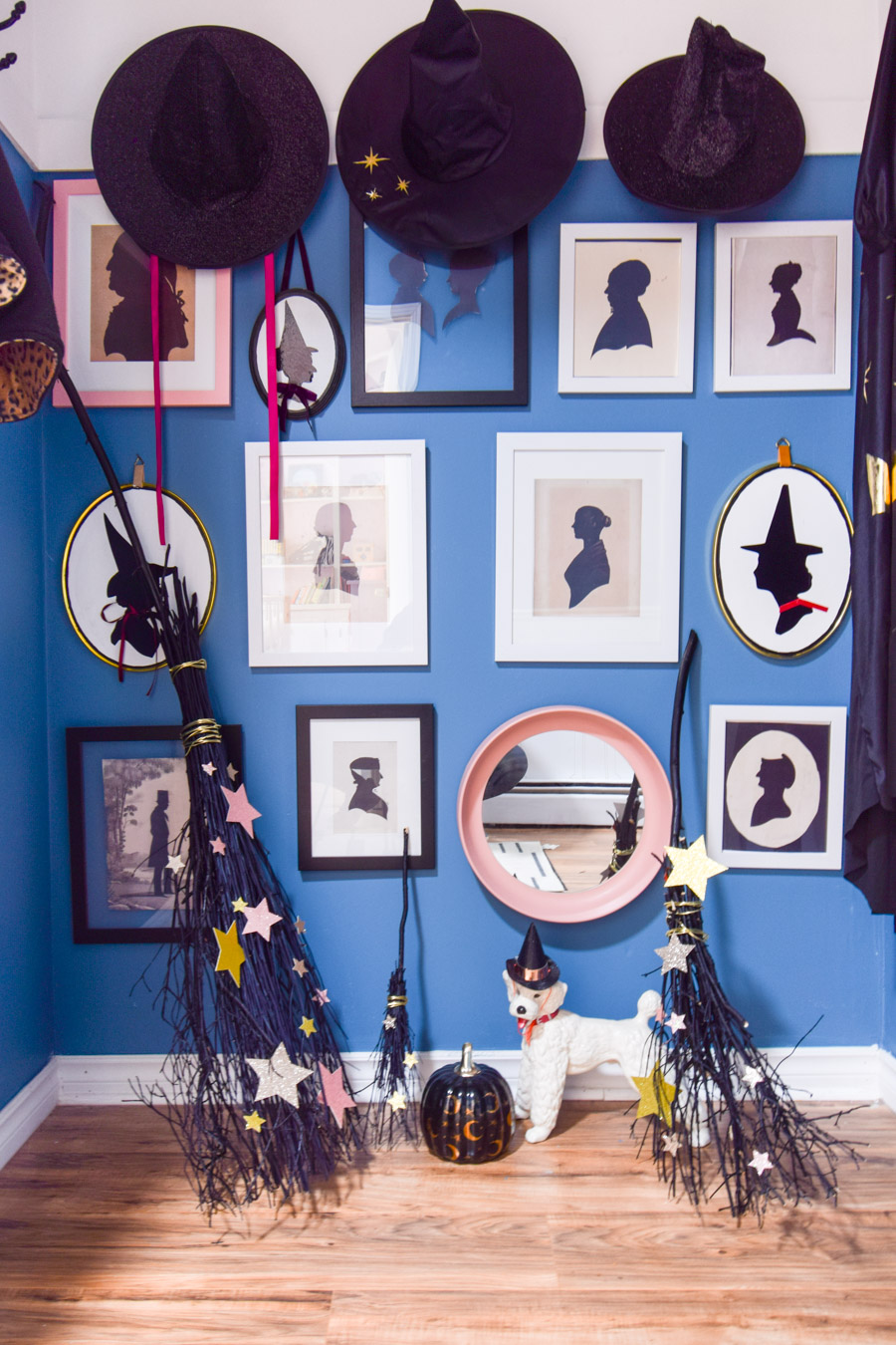 Turn your entryway into a spooky and glam witch broom closet. One that any witch would be pleased to hang her cloak in.