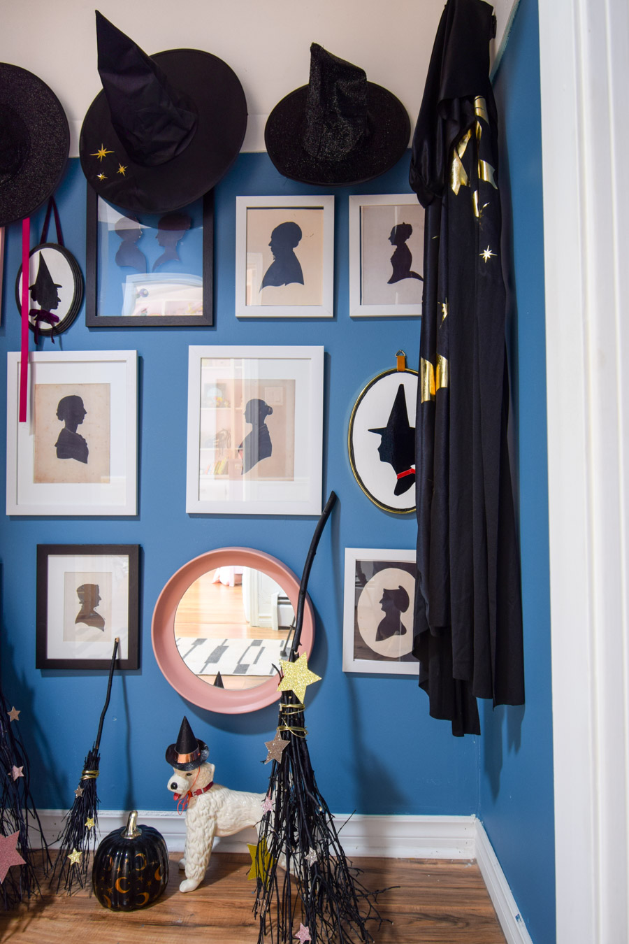 Turn your entryway into a spooky and glam witch broom closet. One that any witch would be pleased to hang her cloak in.