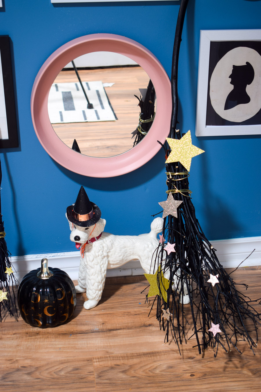 Turn your entryway into a spooky and glam witch broom closet. One that any witch would be pleased to hang her cloak in.