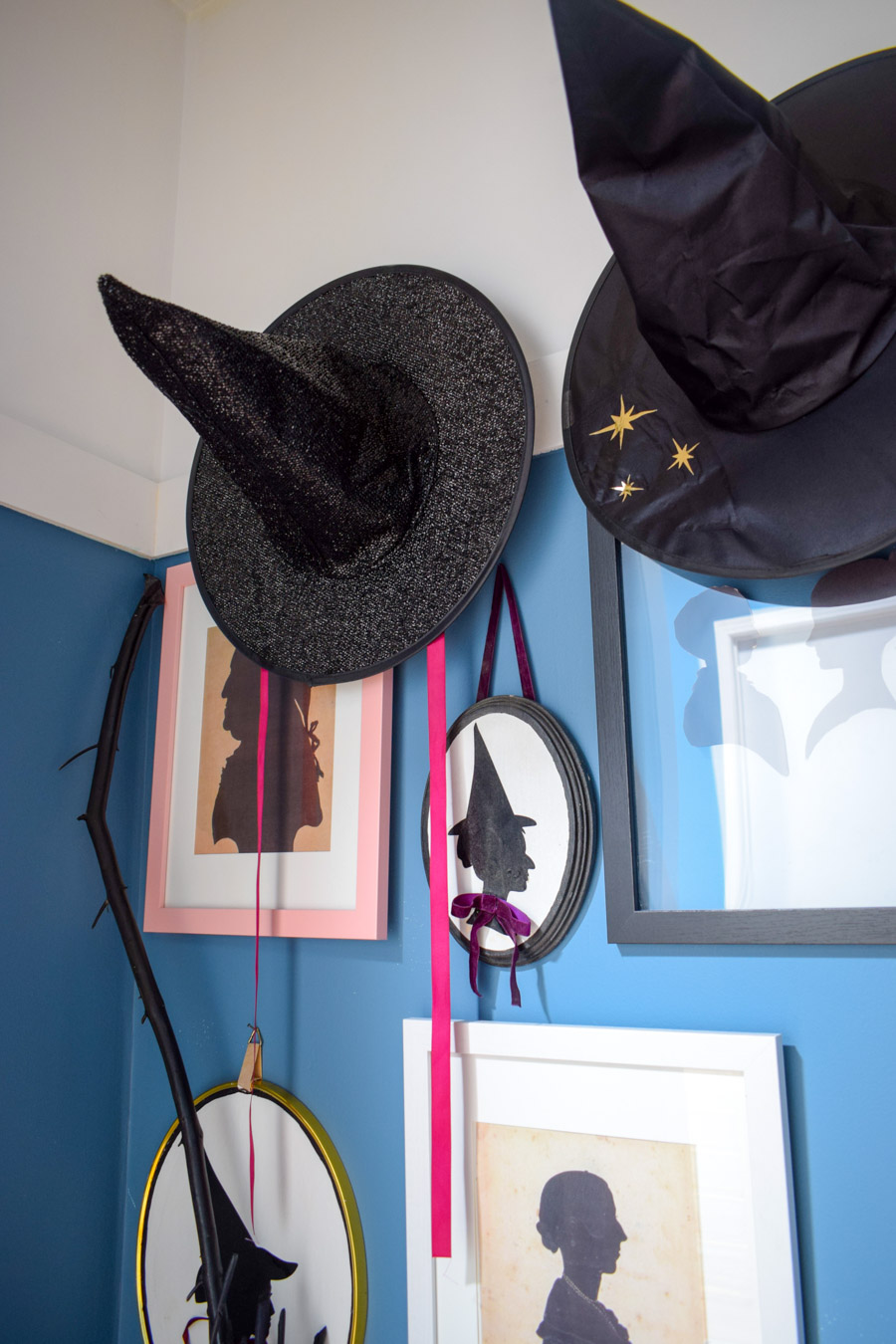 Turn your entryway into a spooky and glam witch broom closet. One that any witch would be pleased to hang her cloak in.