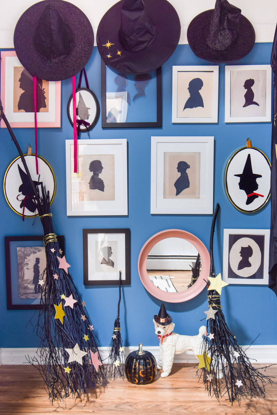 Turn your entryway into a spooky and glam witch broom closet. One that any witch would be pleased to hang her cloak in.