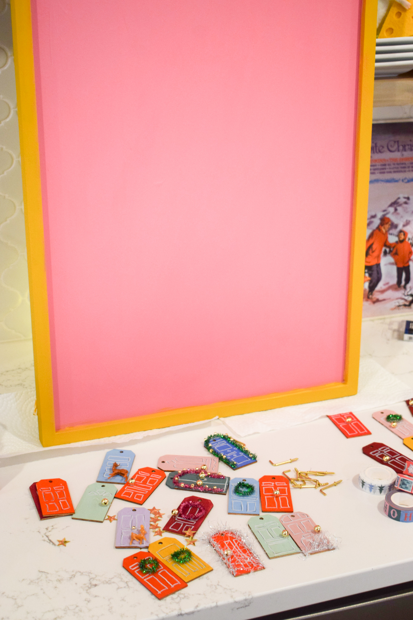 make a fun DIY reusable advent calendar that looks like all the fun and festive snow covered doors in your city or neighbourhood.